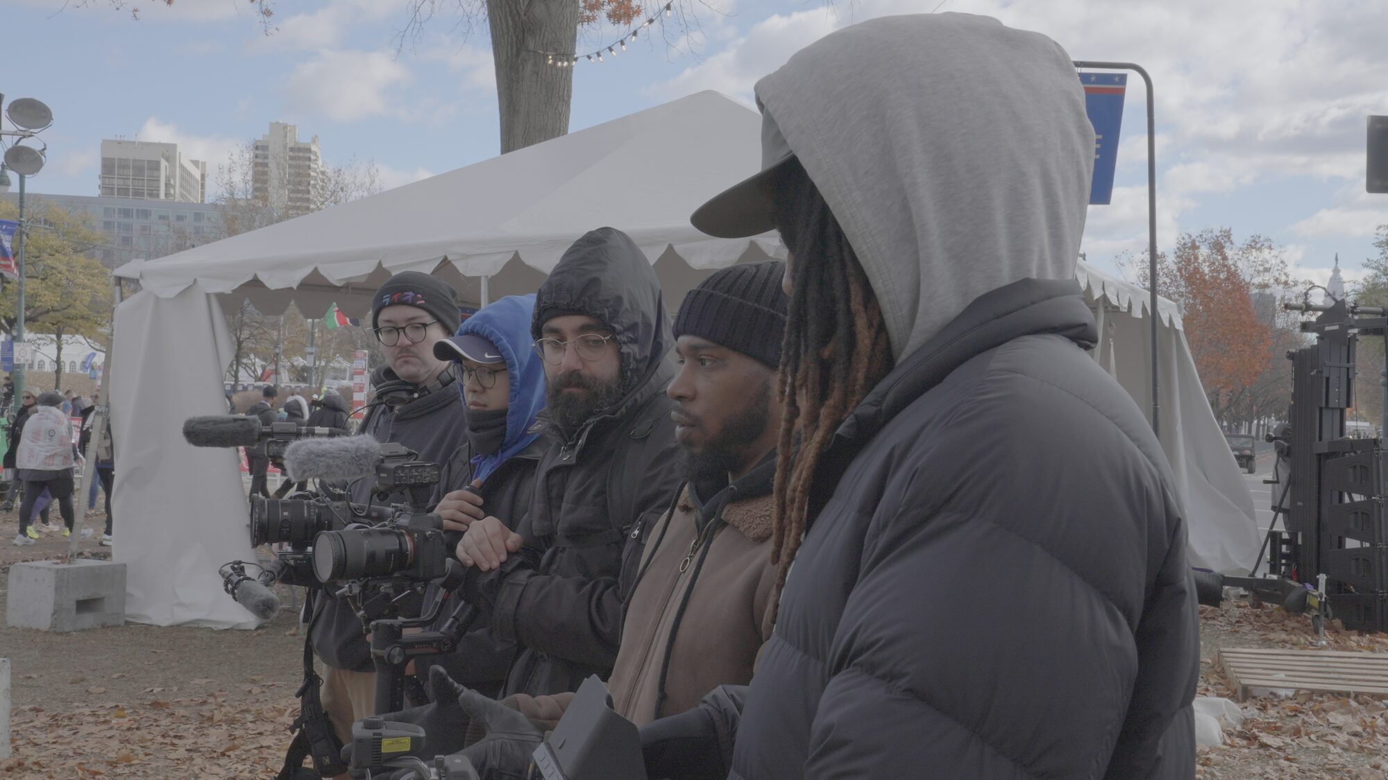 The crew filming outdoors